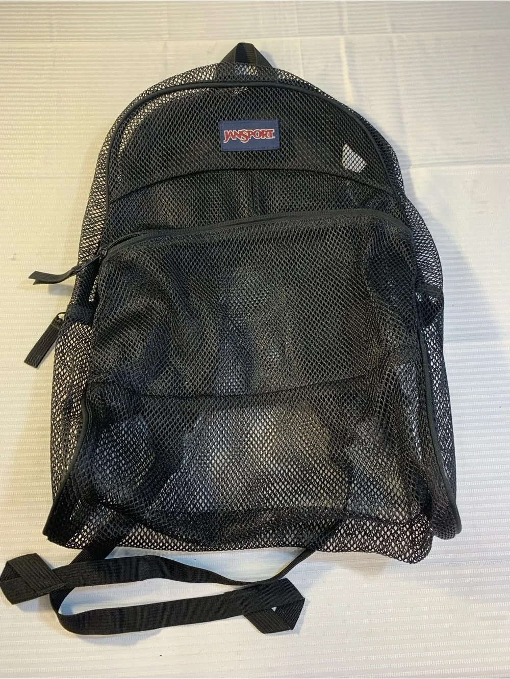 JanSport Mesh Pack Backpack in Black, a semi-trans. EC style TB500315